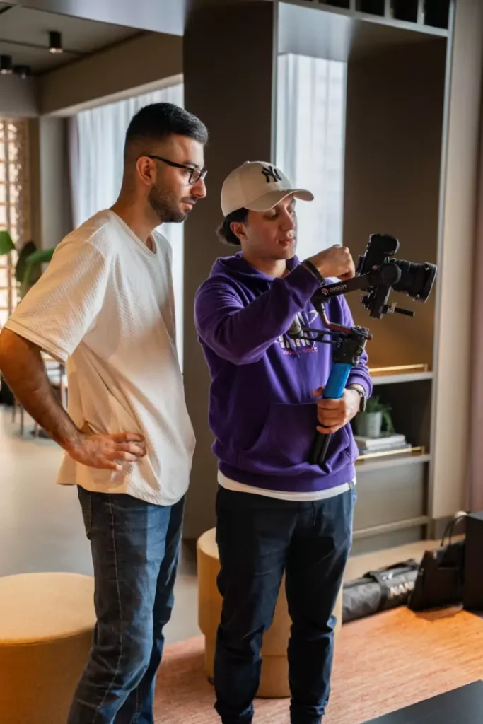 Two of the Minutes team filming a shoot together