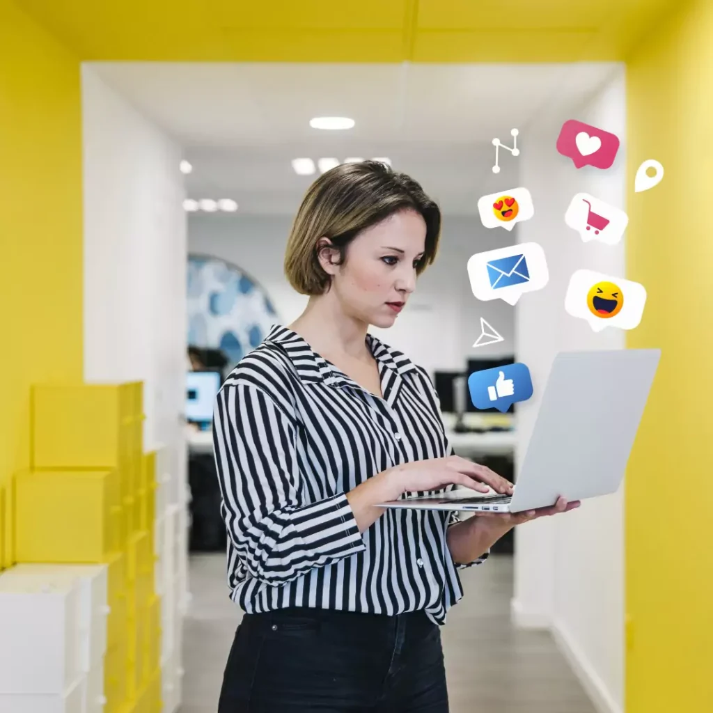 A member of the Minutes team managing social channels on a laptop